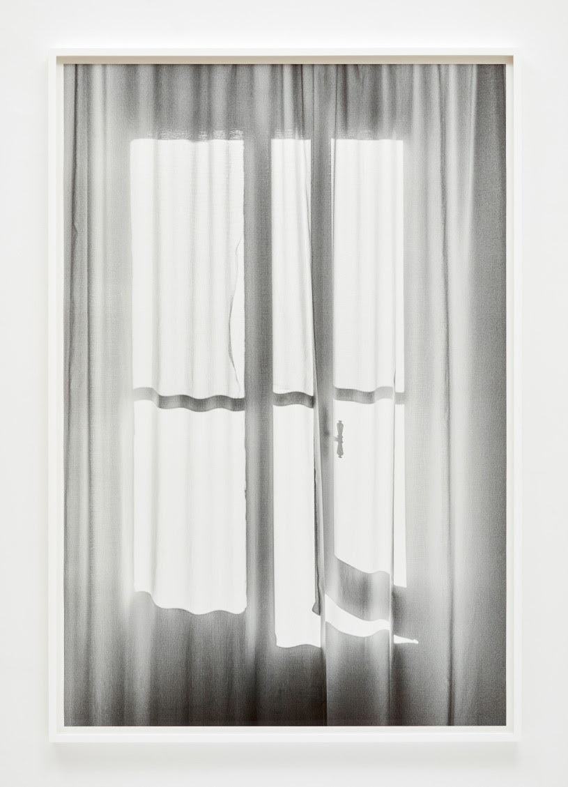 image of an open window behind sheer curtains